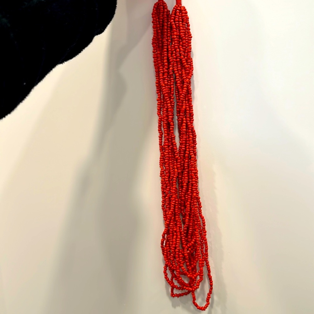 Brand new without tags orange beaded necklace.